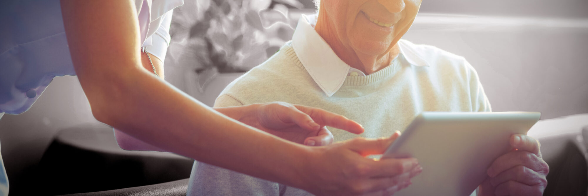 female nurse showing medical report senior man digital tablet scaled